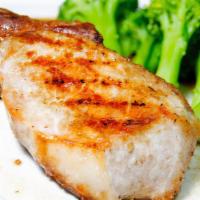 Broiled Pork Chop · Served with mashed potatoes and vegetables