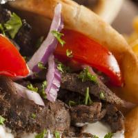Gyro Pita · Gyro meat with lettuce, tomatoes, onions and sam's tzatziki sauce.