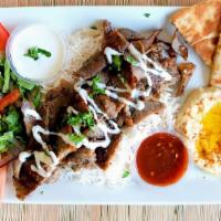 Gyro Platter · Gyro meat served on a bed of rice with salad, pita bread and sam's tzatziki sauce.
