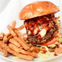 Smokehouse Stack Burger · American cheese, pickles, lettuce, tomato, grilled onions, bacon, and bbq sauce.