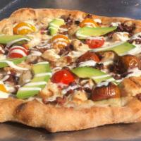 Large Golden Gate Pizza · Olive oil base, mozzarella cheese, bacon, chicken, tomatoes, avocado, ranch drizzle, Parsley.