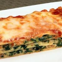 Small Lasagna With Spinach · Serves one. wide pasta layered with ricotta cheese, mozzarella cheese, meat and spicy sauce.