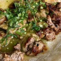 Street Taco · Grilled meat on normal sized corn tortillas topped with salsa verde & cilantro. steak or chi...