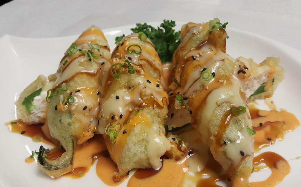Stuffed Jalapeno (6 Pc) · Deep fried jalapeno stuffed with crab mix and cream cheese drizzled with house sauce.
