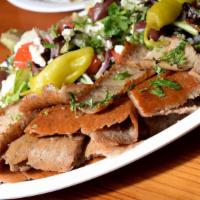 Gyros Greek Salad · Cuts of traditionally seasoned lamb and beef gyros kebab slowly roasted and crisped to perfe...