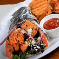 Organic Chicken Kebab Wrap · Marinated chicken breast skewered and charbroiled to perfection wrapped in pita bread with l...
