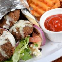 Falafel Wrap · Five pieces of homemade falafel wrapped in pita bread with lettuce, tomato, onion, feta chee...