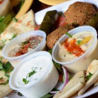 The Combo App Sampler · Combination of our signature Tzatziki, Hummus, Green Cilantro, and Baba Ghanooj Sauces with ...