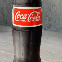 Mexican Coke · Mexican Coke-Made with pure cane sugar, no high fructose corn syrup, in a glass bottle. 355 ml
