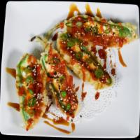 Jalapeno Bombs · Deep fried tempura jalapenos stuffed with cream cheese and spicy tuna, topped with spicy sau...