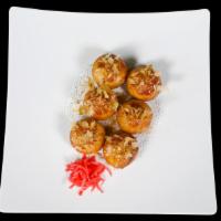 Takoyaki · Deep fried Octopus balls topped with takoyaki sauce, and Bonito flakes.