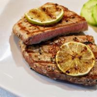 Seared Tuna Steak · 8 oz of fresh seared Tuna (cook outside raw inside), steamed rice, and medium pickled cucumb...