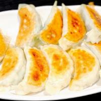 Pan Fried Dumplings · 10 pieces. Contains pork, shrimp, eggs, cabbage and chives
