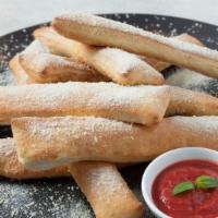 Breadsticks · Eight piece of breadsticks plus a side of marinara sauce