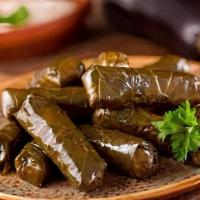 Dolmathes (6 Pcs.) · Cooked grape leaves stuffed with a savory mix of rice, fresh mint, tomato and olive oil.