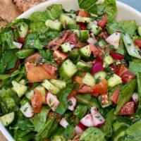 Fattoush · Romaine lettuce salad with fresh tomatoes, cucumber, parsley, red radishes, mint, garlic, le...