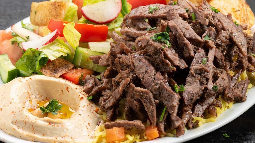 Gyro Plate · Gyro Plate
lamb & beef seasoned sliced and marinated overnight served with rice, hummus, Pita, Fata Cheese and Fattoush salad.