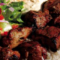 Beef Kabob · Marinated and char- grilled tender filet of beef, served with rice hummus salad and vegetabl...