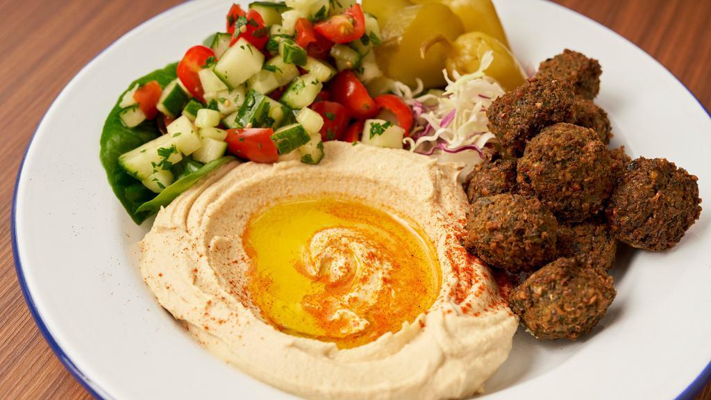 Falafel Plate · Comes with 4 pieces falafel, hummus, fattoush salad and dolmathes .