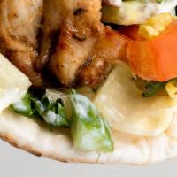 Chicken Shawarma Wrap · Tender chicken breast seasoned, sliced and marinated overnight then served with tahini sauce...