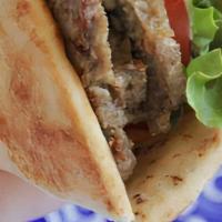 Beef Shawarma Wrap · Lean beef seasoned, sliced and marinated overnight, then served with tahini sauce, onions, l...