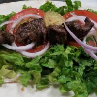 Lamb Kabob Wrap · Grilled cubes of tender lamb, marinated and sliced served with lettuce, tomatoes, seasoned o...