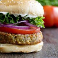Falafel Burger · 1/4 Lb Falafel , Tahini Sauce, Lettuce , Pickles, Onions, Tomato.