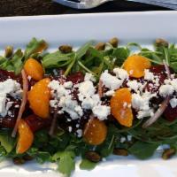 Roasted Beet Salad (New) · Vegetarian. Baby arugula, roasted beets, creamy goat cheese, pistachios, mandarins with bloo...