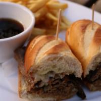 Rc'S Famous Dip · Thinly sliced beef, manchego cheese, and house-made au jus.