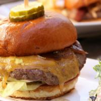 House Burger · Ground short rib and brisket patty, lettuce, tomato, grilled onion, cheddar cheese, and must...
