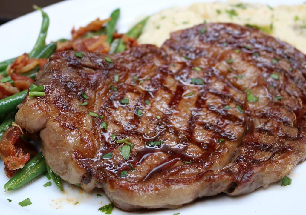 Grilled Ribeye · 12oz Grilled ribeye, served with mashed red potatoes and roasted seasonal vegetables
