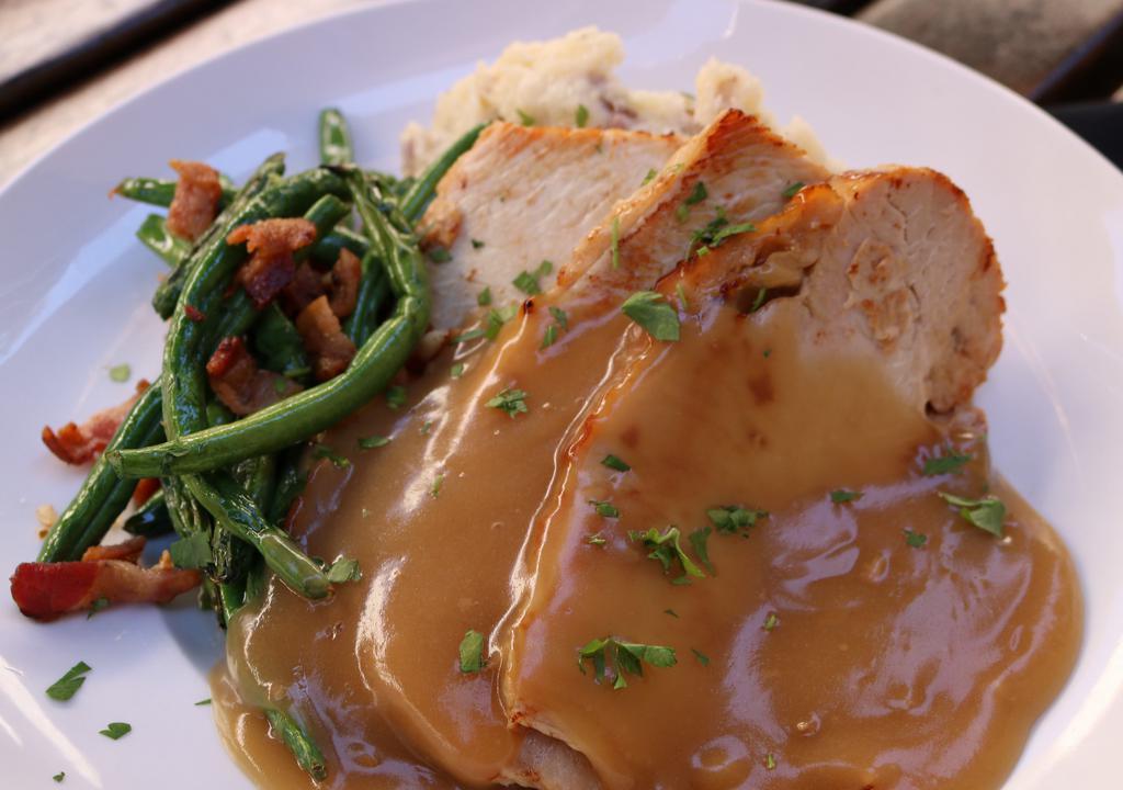 Roasted Turkey Dinner · Roasted turkey breast & gravy. Served with mashed potatoes and green beans with bacon