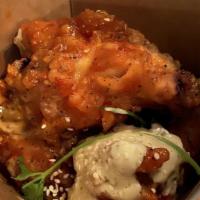 Wu Wings | Shaolin Style · 5 wings. Spicy chili and sesame sauce. Topped with cilantro, sesame seeds, and house C.R.E.A...