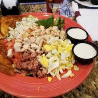 Buffalo Chicken Salad · Chicken tenders tossed in our famous wing sauce with romaine lettuce, diced tomatoes, celery...