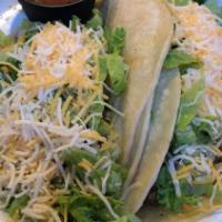 Tacos · With tostada chicken, seasoned ground beef or carnitas, served on red and white corn tortill...