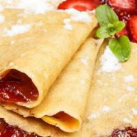 Strawberry Crepe · Two crepes with sweet and deliciously fresh strawberries and topped with whipped cream