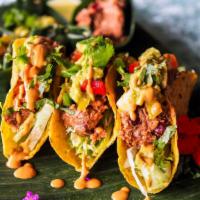 Crispy Veggie Tacos · Crispy fried tortilla shell loaded with roasted cremini mushrooms, toasty crumbled tempeh, c...