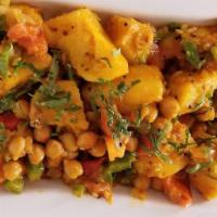Bombay Aloo · Diced potatoes cooked in aromatic indian curry sauce
