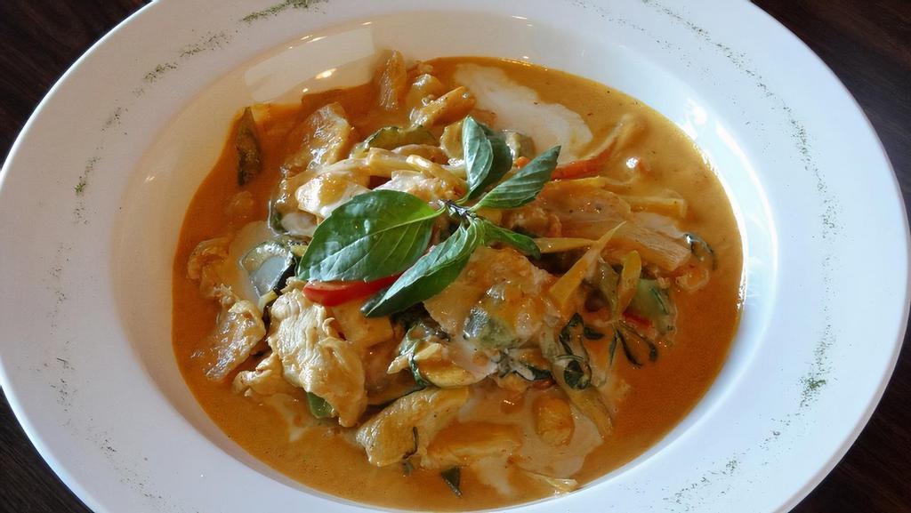 Red Curry · Curry coconut milk with red chili paste, bell peppers, carrots, bamboo shoots and Thai basil.