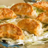 Crispy Dumplings (Chicken 6 Pieces) · Tasty dumplings stuffed with chicken and fresh vegetables. Pan fried served with soy and gin...