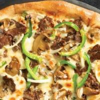 Crispy Thin Philly Pizza · Melty white cheese sauce piled high with tender shaved steak, marinated mushrooms, freshly s...