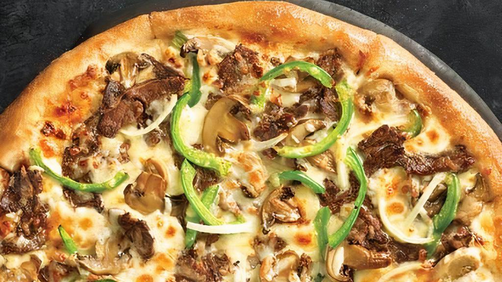 Crispy Thin Philly Pizza · Melty white cheese sauce piled high with tender shaved steak, marinated mushrooms, freshly sliced green peppers and onions and our three fresh signature cheeses