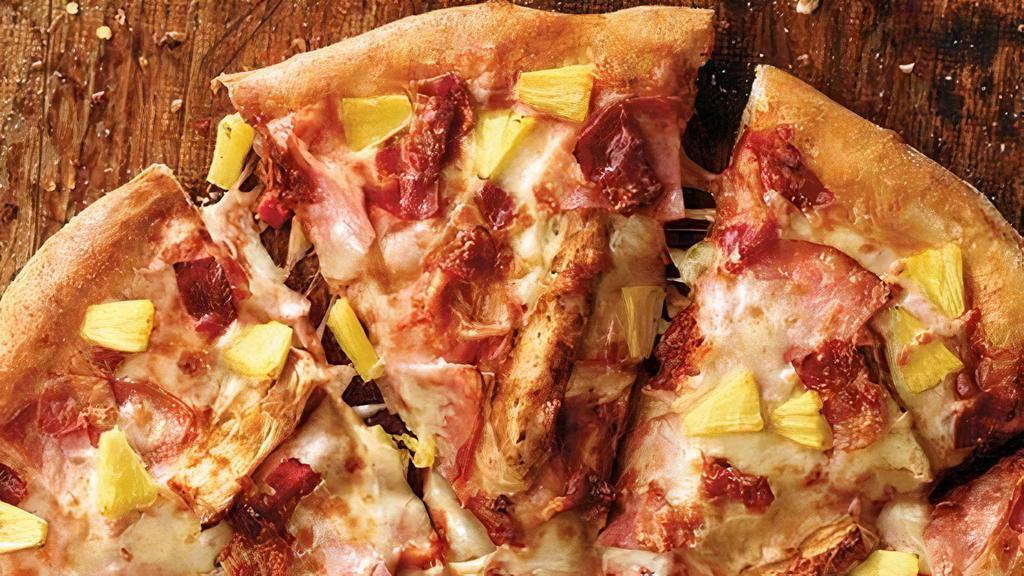 Crispy Thin Crust Hawaiian Chicken Pizza · Ham, grilled chicken, bacon, pineapple, our original sauce and signature three cheeses