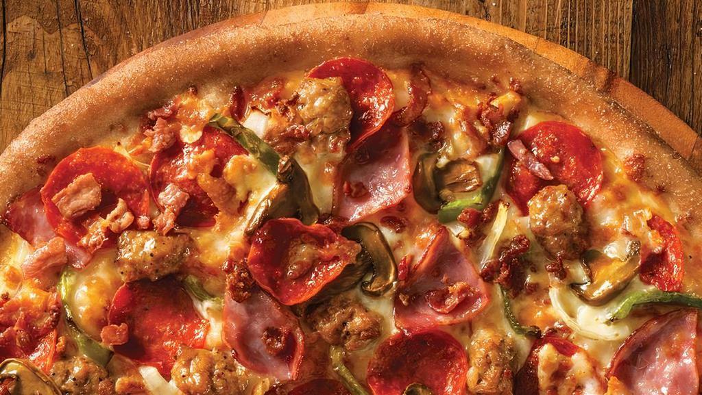 The Works Pizza · Pizza Sauce, Cheese, Original Crust, Pepperoni, Ham, Green Peppers, Italian Sausage, Mushrooms, Bacon and Onions.