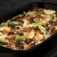 Philly Bowl · Crustless pizza baked in a bowl. Melty white cheese sauce, tender shaved steak, marinated mu...