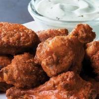 Chicken Wings (6 Pcs.) · Classic chicken wings served Hot or Tangy BBQ style with your choice of dipping sauce.