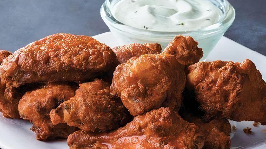 15 Piece Chicken Wings · Classic bone-in wings served Plain, Hot or Tangy BBQ-style with your choice of dipping sauce.
