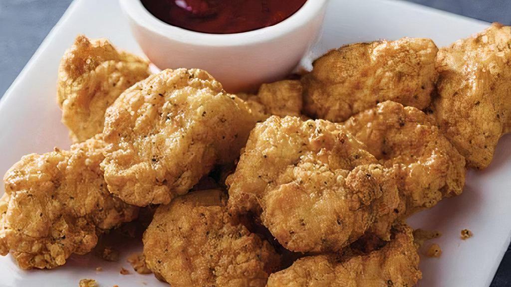 Chicken Dippers (15Pc) · Tender all-white meat breaded chicken served with your choice of dipping sauce.
