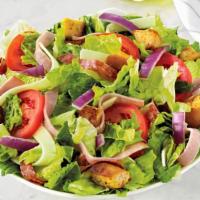 Italian Chef Salad (Family) · Fresh-cut lettuce blend, ham, salami, provolone cheese, sliced tomatoes, red onions and crou...