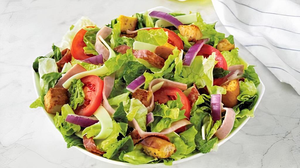 Chef (Family - 4 Servings) · Fresh-cut lettuce blend, ham, salami, provolone cheese, sliced tomatoes, red onions, and croutons made daily; served with Italian dressing. 630 cal.; 158 cal. per serving.